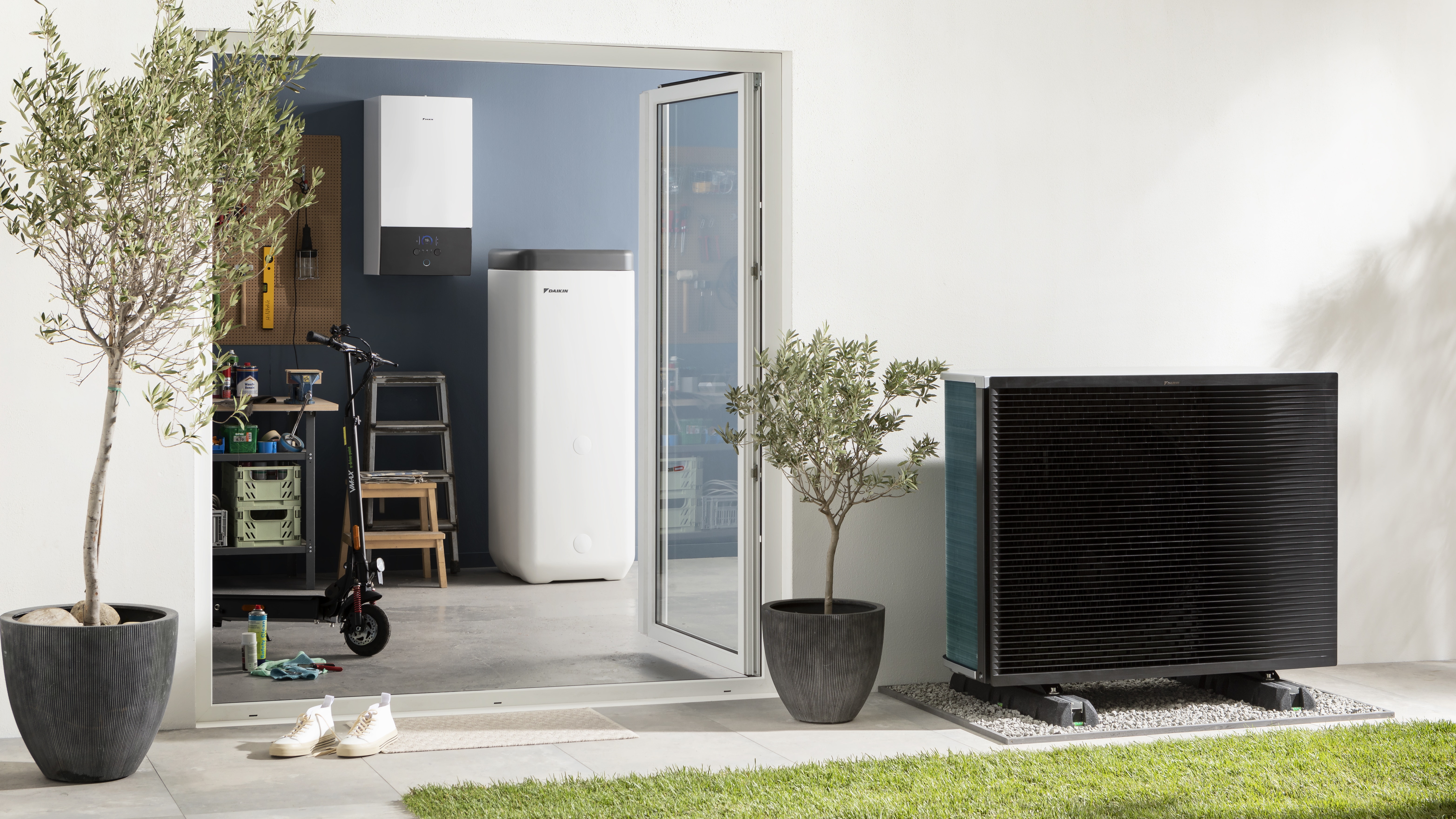 Hot water tank and outdoor unit seamlessly blending in in the storage room and garden