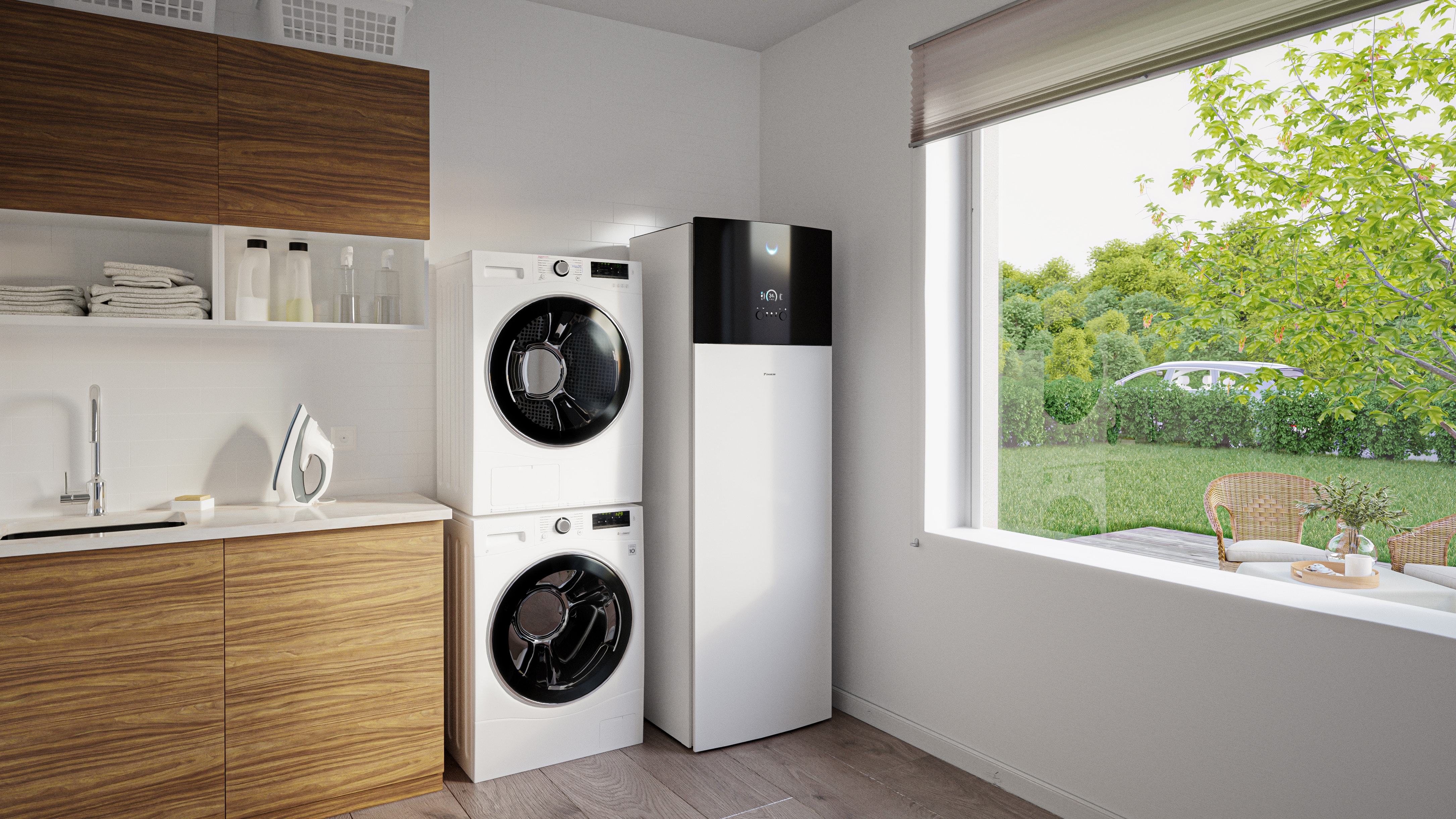 Air-to-water heat pump indoor unit with integrated hot water tank standing next to washer and dryer