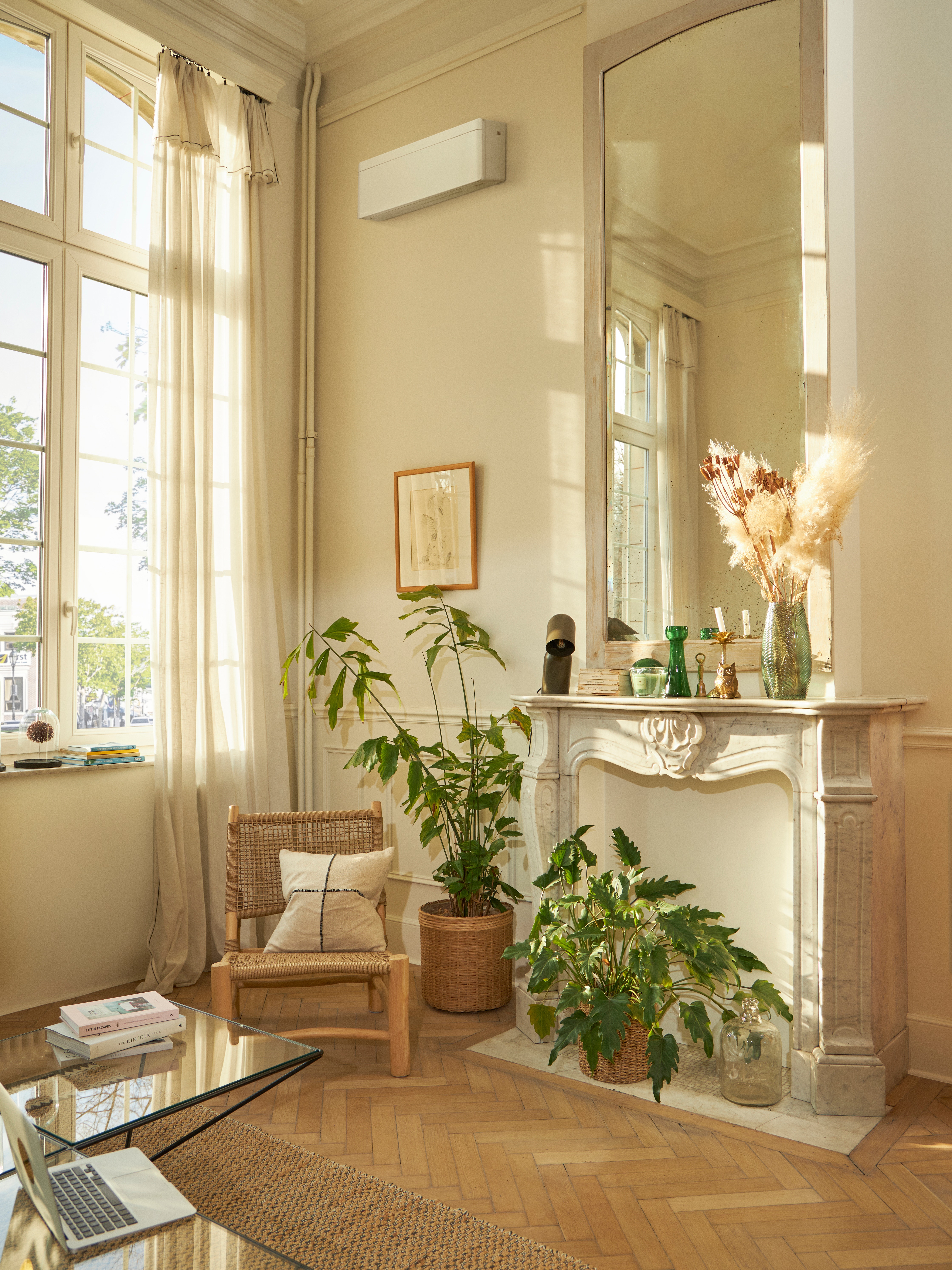 Beautifully decorated living room with a white wall-mounted climate system